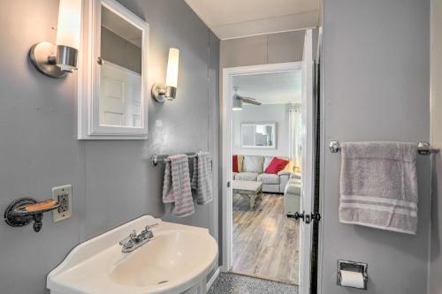 a bathroom with a sink and a mirror at Lakefront Cottage with Fishing and Private Yard! in Port Clinton