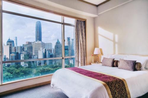 Postel nebo postele na pokoji v ubytování Garden View Hong Kong