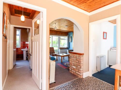 a home with a hallway and a living room at Meadowsweet in Skegness