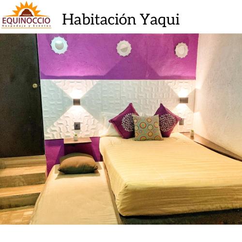 a bedroom with two beds with purple walls at Posada Equinoccio in Bernal
