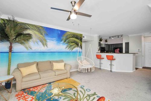 a living room with a couch and a palm tree mural at Island Paradise -2Bedroom /2Bath/NRG/MedCenter/Galleria in Houston