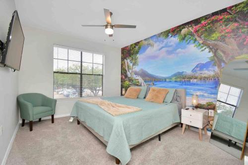 a bedroom with a large painting on the wall at Island Paradise -2Bedroom /2Bath/NRG/MedCenter/Galleria in Houston