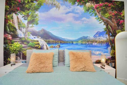 a bedroom with a painting of a waterfall and a lake at Island Paradise -2Bedroom /2Bath/NRG/MedCenter/Galleria in Houston