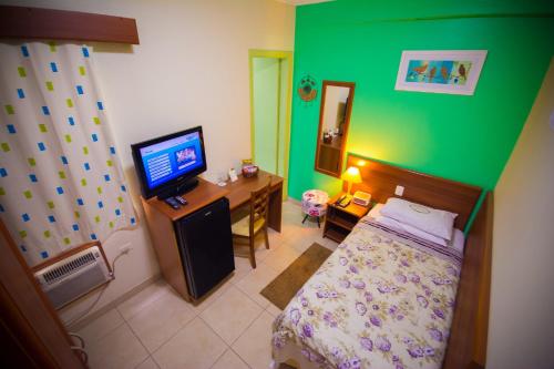Postel nebo postele na pokoji v ubytování Hotel Valparaíso - Metrô Paraíso e 800m da Av Paulista