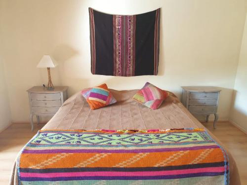 Tempat tidur dalam kamar di Aruma Codpa