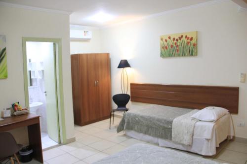 Postel nebo postele na pokoji v ubytování Hotel Valparaíso - Metrô Paraíso e 800m da Av Paulista