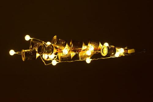 a group of lights on a wire in the dark at Zeus Bungalow in Kotagiri
