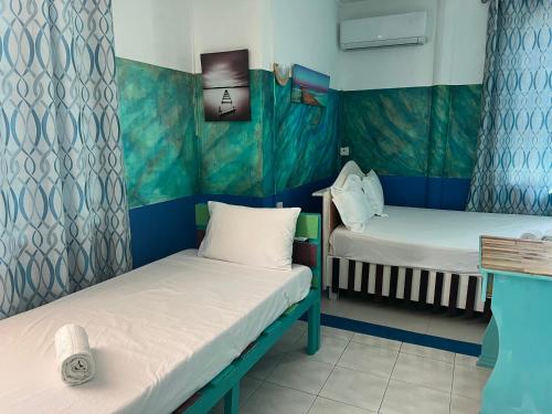 Postel nebo postele na pokoji v ubytování Eden Villa