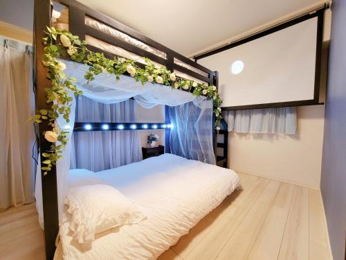 Ένα ή περισσότερα κρεβάτια σε δωμάτιο στο 歌舞伎町ヤスオroom