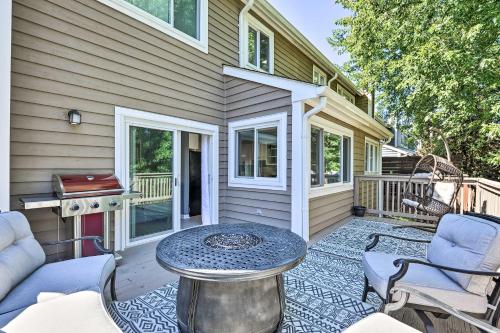 a patio with a table and chairs on a house at Annapolis Vacation Home 2 Mi to Quiet Waters Park in Annapolis