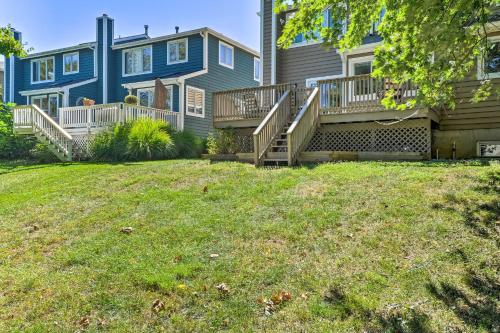 a blue house with stairs and a yard at Annapolis Vacation Home 2 Mi to Quiet Waters Park in Annapolis