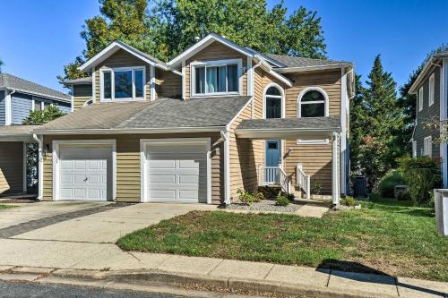 a house with two garage doors on a street at Annapolis Vacation Home 2 Mi to Quiet Waters Park in Annapolis