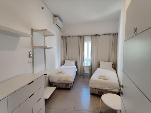 Cama o camas de una habitación en Begin19 Apartments & Hostel