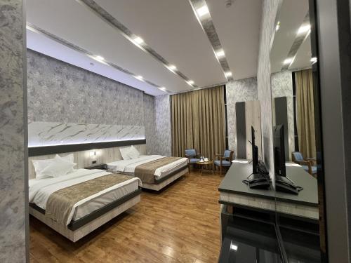 Postel nebo postele na pokoji v ubytování Ada Hotel