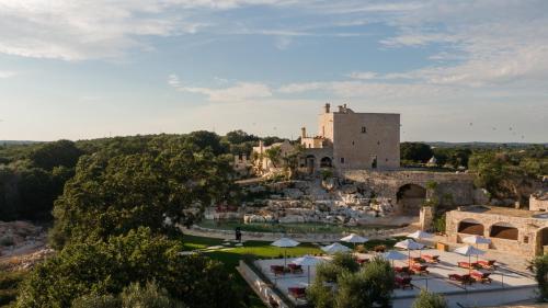 an aerial view of a village with a castle at Masseria San Paolo Grande in Ostuni