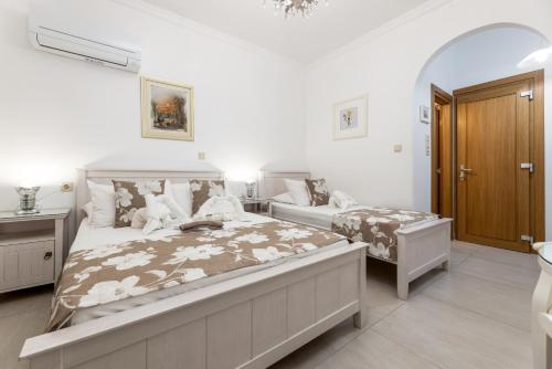 Ένα ή περισσότερα κρεβάτια σε δωμάτιο στο Panos Luxury Studios