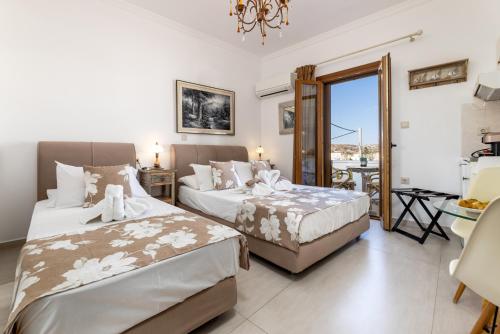 Ένα ή περισσότερα κρεβάτια σε δωμάτιο στο Panos Luxury Studios