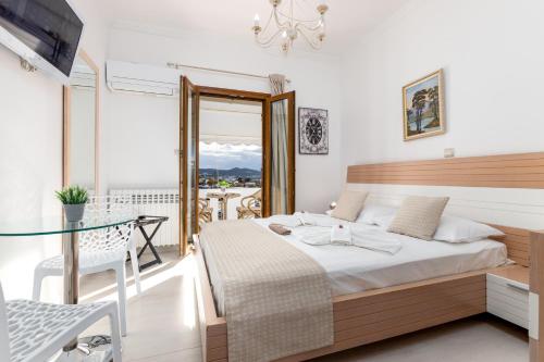 Ένα ή περισσότερα κρεβάτια σε δωμάτιο στο Panos Luxury Studios