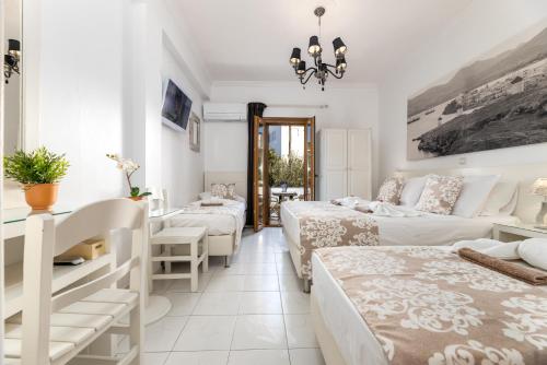 Ένα ή περισσότερα κρεβάτια σε δωμάτιο στο Panos Luxury Studios