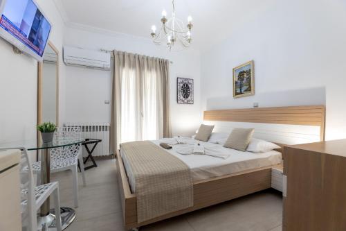 Ένα ή περισσότερα κρεβάτια σε δωμάτιο στο Panos Luxury Studios