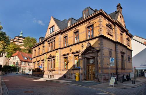 an old building on the corner of a street at Alte Post Sondershausen in Sondershausen
