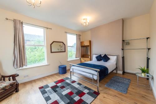 a bedroom with a bed and a rug at The Chestnut - Liverpool City - L7 in Liverpool