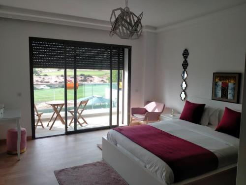 Postelja oz. postelje v sobi nastanitve Splendide villa Anarouz avec piscine