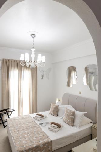 Ένα ή περισσότερα κρεβάτια σε δωμάτιο στο Panos Luxury Studios