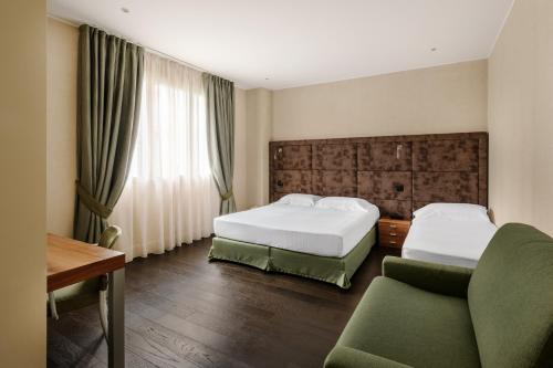 Postel nebo postele na pokoji v ubytování Hotel Cora