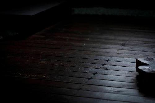 a wooden floor with a bench on it at Busuitei in Hida
