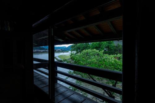 a window view of a river from a house at Busuitei in Hida