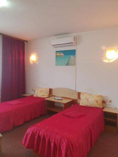 Ένα ή περισσότερα κρεβάτια σε δωμάτιο στο Vila Queen