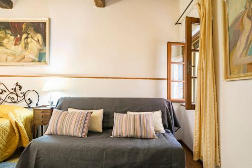 a bedroom with a bed with two pillows at Vicolo Curtatone 30 in Foiano della Chiana