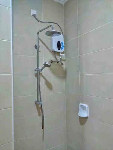 a shower with a shower head in a bathroom at Setia Alam @ SCCC 3 Storey House in Shah Alam