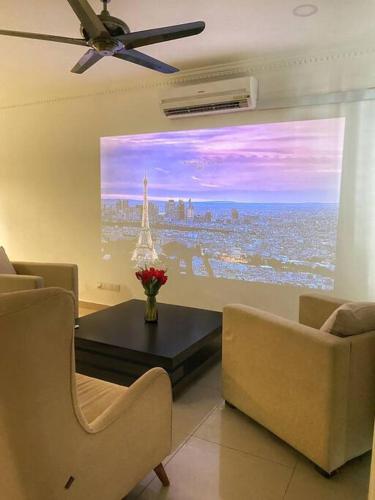 a living room with a view of a city at Setia Alam @ SCCC 3 Storey House in Shah Alam