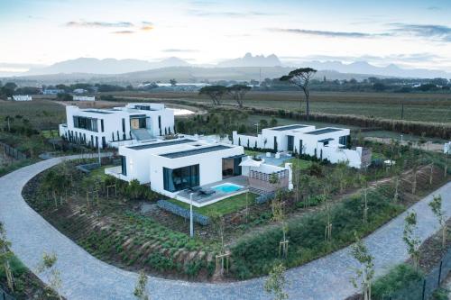an aerial view of a house in a field at Vergenoegd Löw Boutique Hotel & Spa in Cape Town