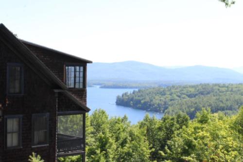 a view of a lake from a house at Clear Skies in Holderness