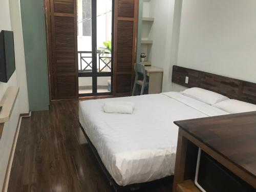 Postel nebo postele na pokoji v ubytování Homestay TITO
