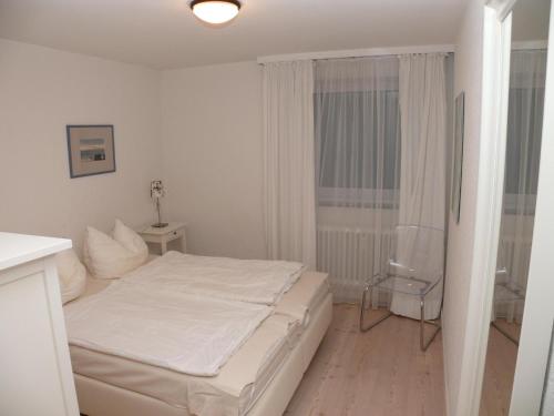Postel nebo postele na pokoji v ubytování Haus Nordseeresidenz Wohnung 09