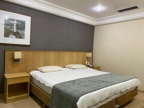 Ένα ή περισσότερα κρεβάτια σε δωμάτιο στο Flat agradável na Barra