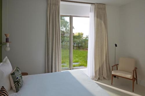 Un ou plusieurs lits dans un hébergement de l'établissement Hôtel de La Plage