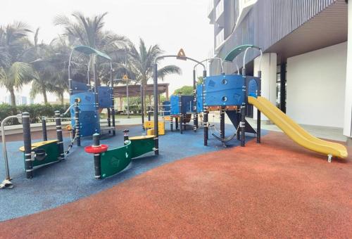 a playground in a building with a slide at Almas Family Studio 100mbps Netflix By STAY in Nusajaya