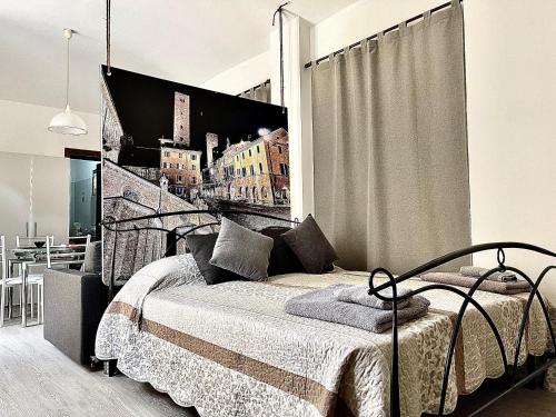 a bedroom with a bed with a poster of a city at 10mt dal Duomo Ca del Duomo in Alba