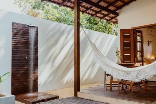 a hammock on the patio of a house at Recanto Alter do Chão in Alter do Chao