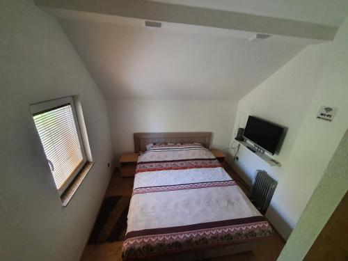 Ένα ή περισσότερα κρεβάτια σε δωμάτιο στο House Apartment Azra
