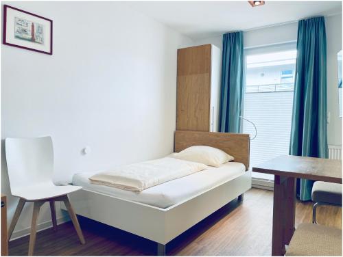 Postel nebo postele na pokoji v ubytování Apartments Boardinghaus Norderney