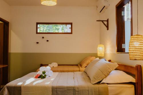 a bedroom with a bed and a window at Recanto Alter do Chão in Alter do Chao