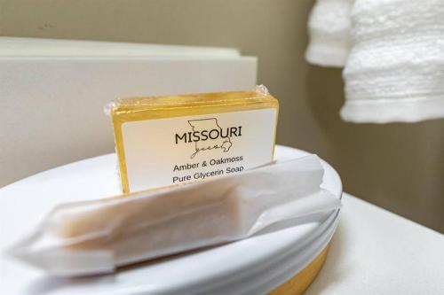 a box of mustard sitting on top of a toilet at The robin nest a cozy cottage on historic main street in St. Charles