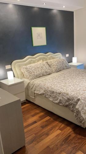 Ένα ή περισσότερα κρεβάτια σε δωμάτιο στο Achille Apartment