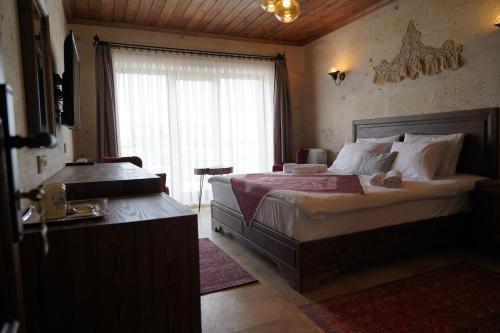 Postel nebo postele na pokoji v ubytování UCHI Cappadocia